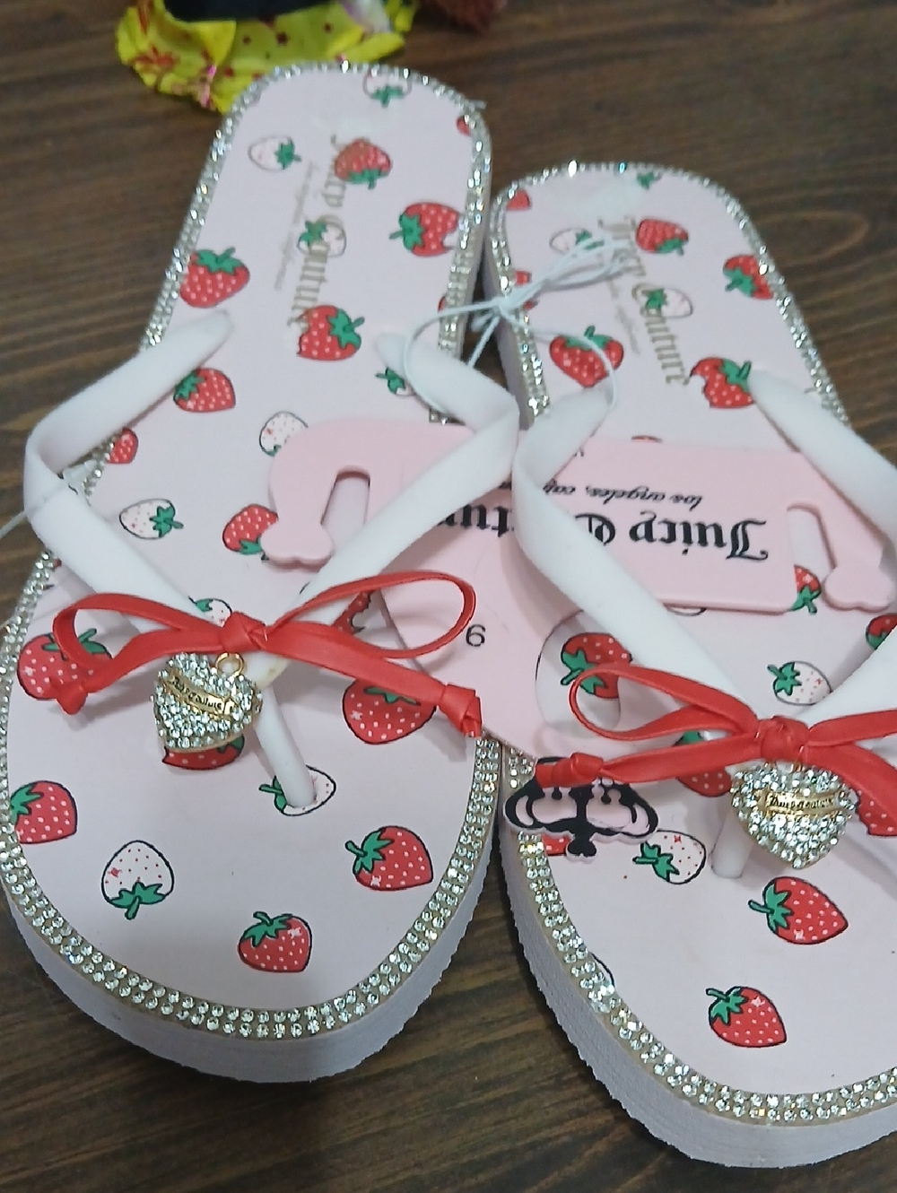Juicy Couture "Slurpy Fruity" Flip-Flops, characterized by a playful strawberry